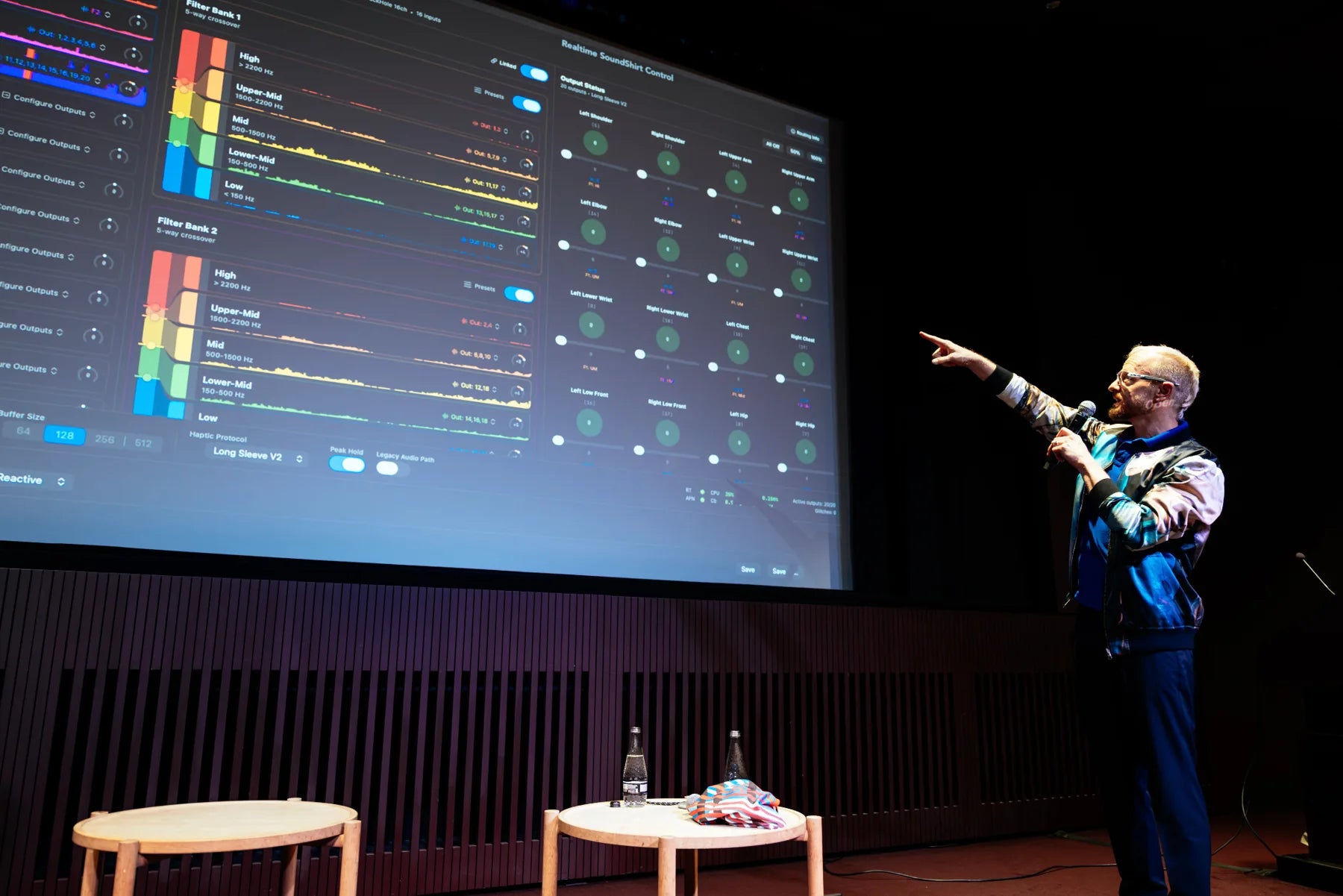 Ryan Genz presenting the Q Pro SoundShirt control interface projected on screen at Tate Modern